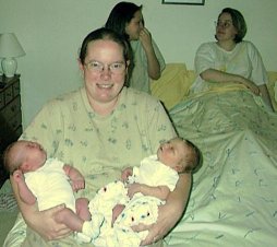 Corrine with two babies she delivered.